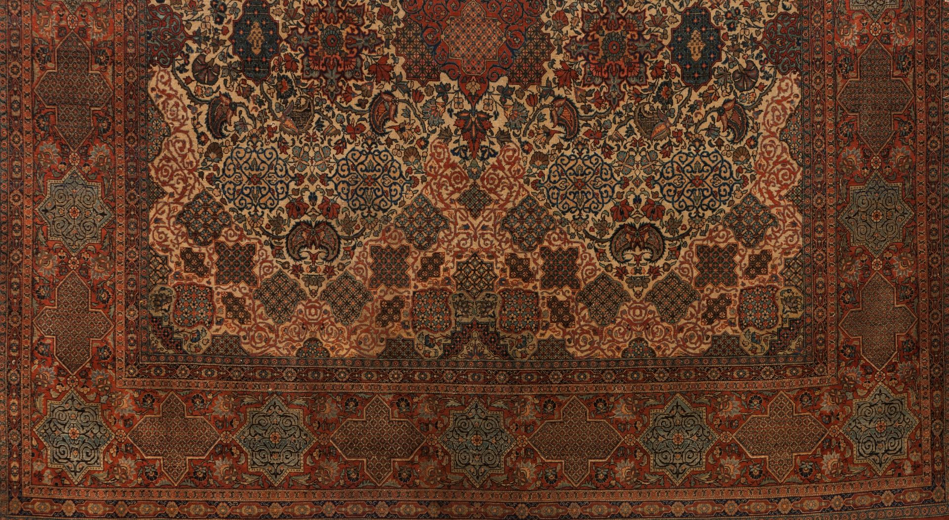 A Shahreza rug, IranWool and cotton Floral pattern of central medallion in red, blue and beige s