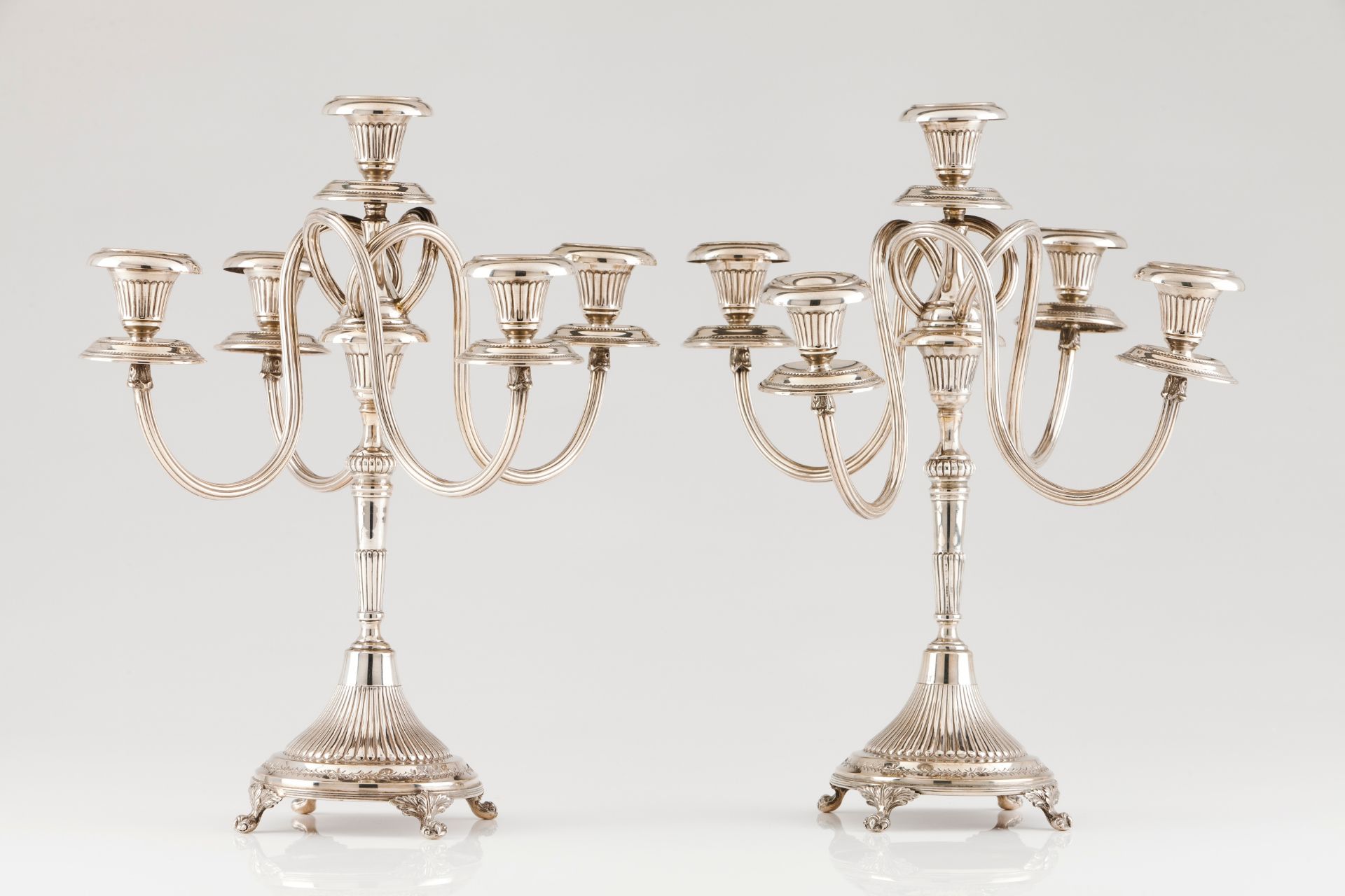 A pair of five branch candelabraPortuguese silver Fluted decoration with removable striated serp