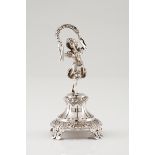 A toothpick holderPortuguese silver Ribbon holding girl figure on a plinth with foliage engraved