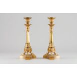 A pair of Empire style candle stands