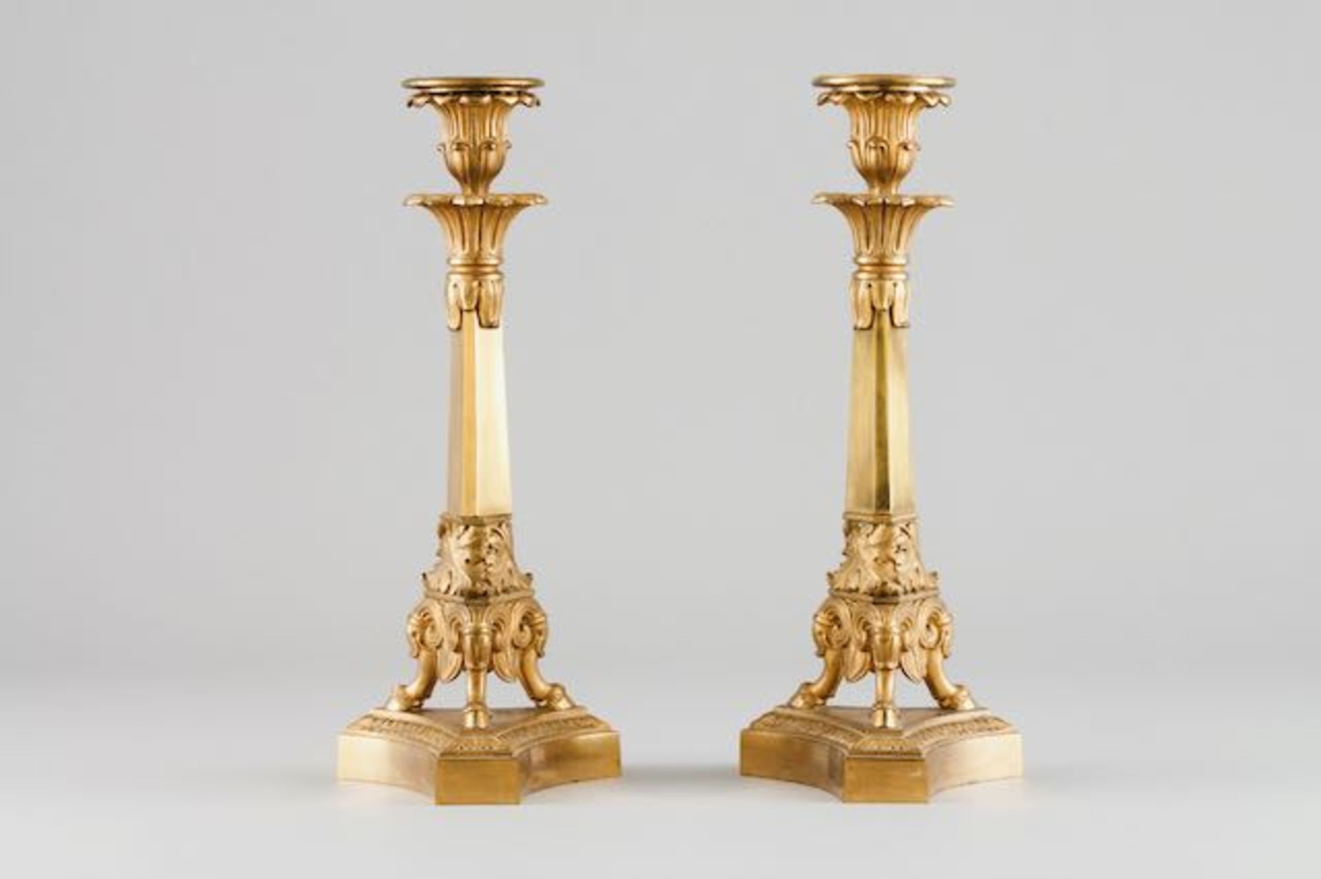 A pair of Empire style candle stands