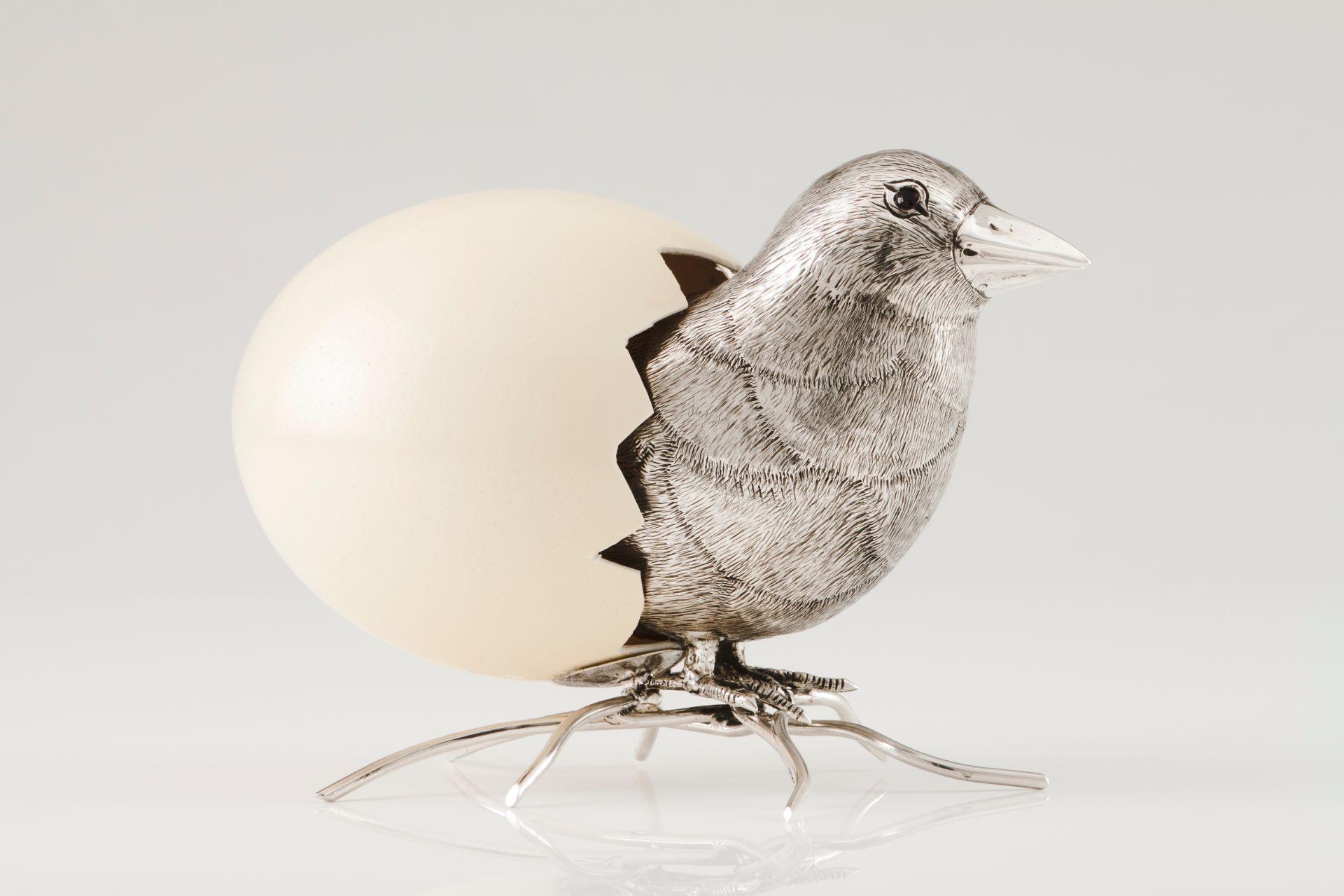 A chickSilver and ostrich egg Moulded, engraved and chiselled silver with glass eyes Rabbit hall