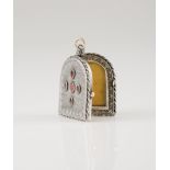A reliquary and picture holderSilver with gold suspension rings Shaped as a Roman arch framed by