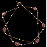 A necklaceGold Pearls, amethyst beads and faceted faux stones strung in gold thread of loop and