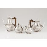 A tea and coffee setPortuguese silver, 19th century Part fluted body of raised floral and