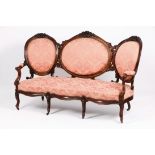 A Romantic era setteeRosewood and burr rosewood veneer Carved decoration Bordeaux silk damask