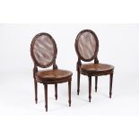 A pair of Louis XVI style chairsCarved and gilt wood Caned seats and backs France, 19th century (