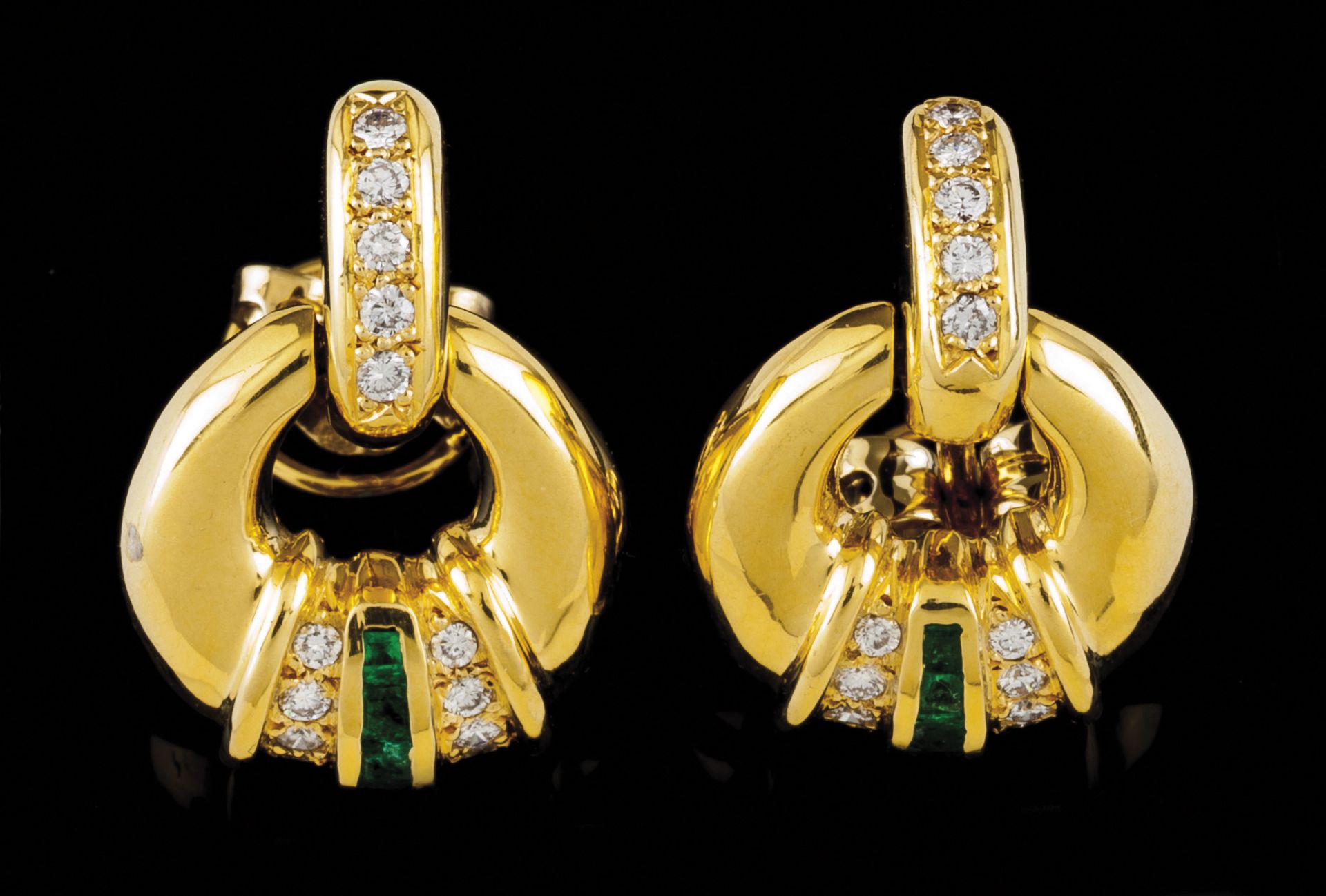 A pair of earringsPortuguese gold Drop loop set with trapeze cut emeralds and small brilliant cut