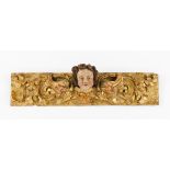 Two carved fragmentsCarved, gilt and polychrome wood Angel's heads and foliage scroll decoration