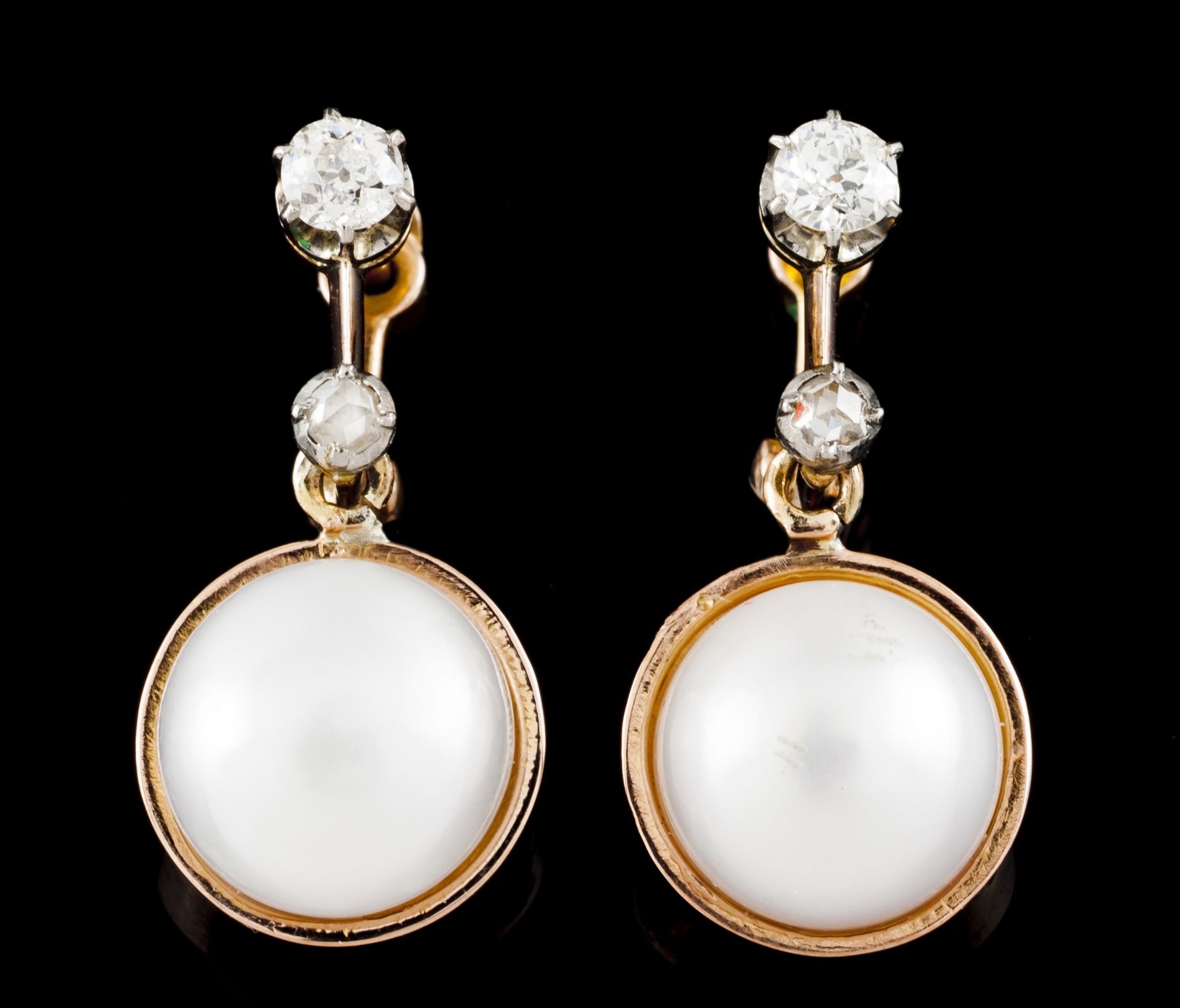 A pair of earringsGold Set with 2 European brilliant cut diamonds totalling (ca. 0.20ct) two crowned