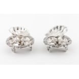 A pair of salt cellarsPortuguese silver, 19th century Shell shaped on a ball foot Gadrooned stand on