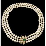 A necklaceTriple strand of cultured pearls (ca. 8/8,5 mm) Stylised flower gold clasp set with one