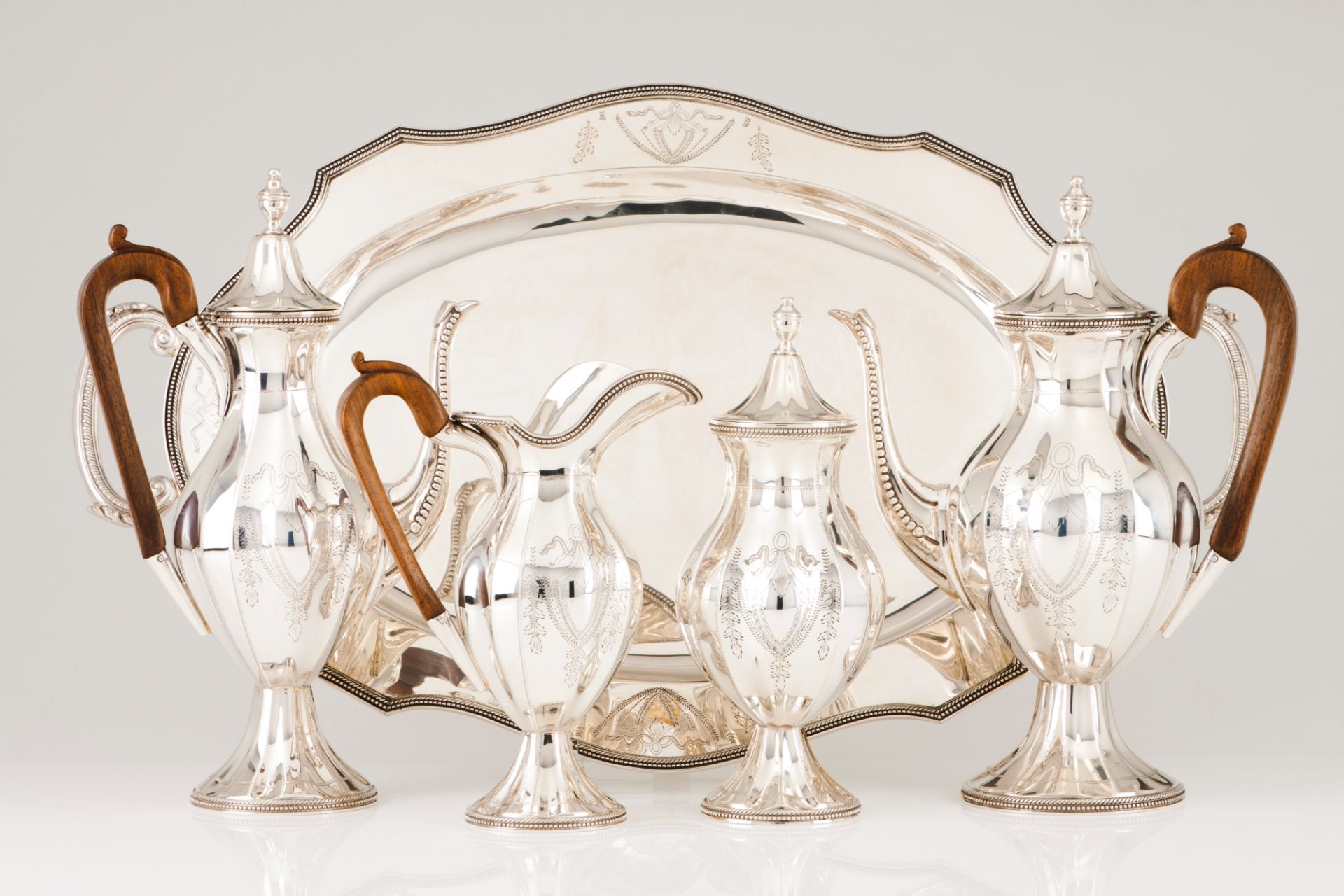 A tea and coffee set with trayPortuguese silver D.Maria style decoration, chiselled baluster body of