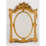 A Napoleon III mirrorCarved and gilt wood and gesso Sectioned frame of central oval bevelled