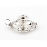 An Art Nouveau chamberstickPortuguese silver Plain shaft and base, scalloped lip of pierced