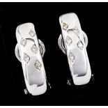 A pair of earringsWhite gold Plain body set with 10 small brilliant cut diamonds Deer hallmark 800/