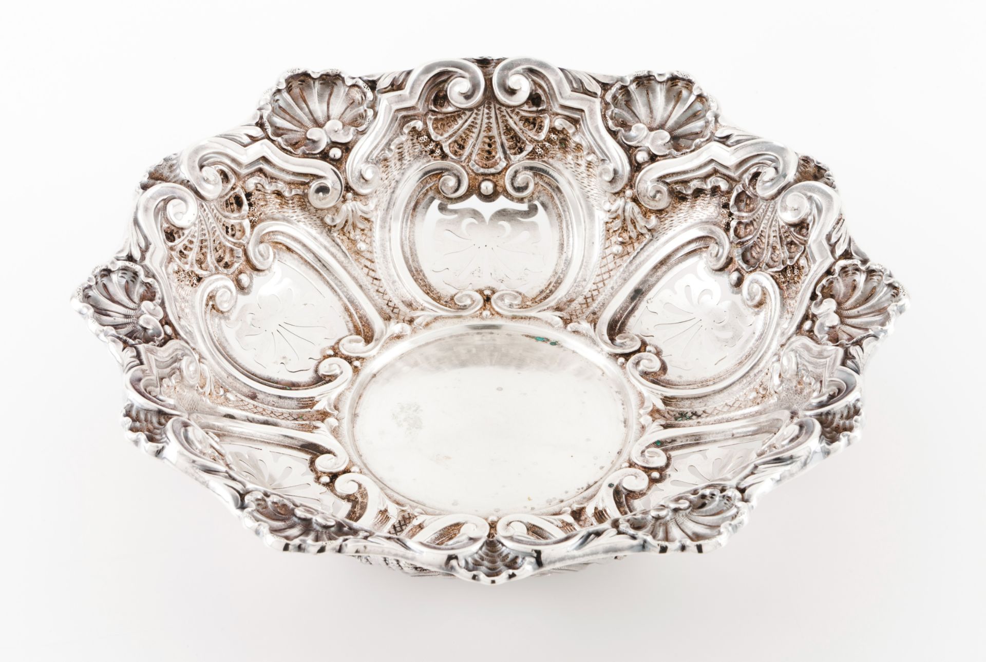 A fruit bowlPlain centre and pierced lip of raised winglet, shell and acanthus decoration Eagle