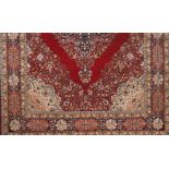 A Ladik rugWool and cotton Red, blue and beige shades of floral pattern and central medallion396x271