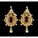 A pair of earringsGold Grained and filigree decoration set with two purple coloured faux stones