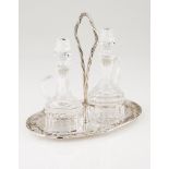 A cruet setPortuguese silver Oval stand of plain centre and lip with raised bow, ribbons and flowers