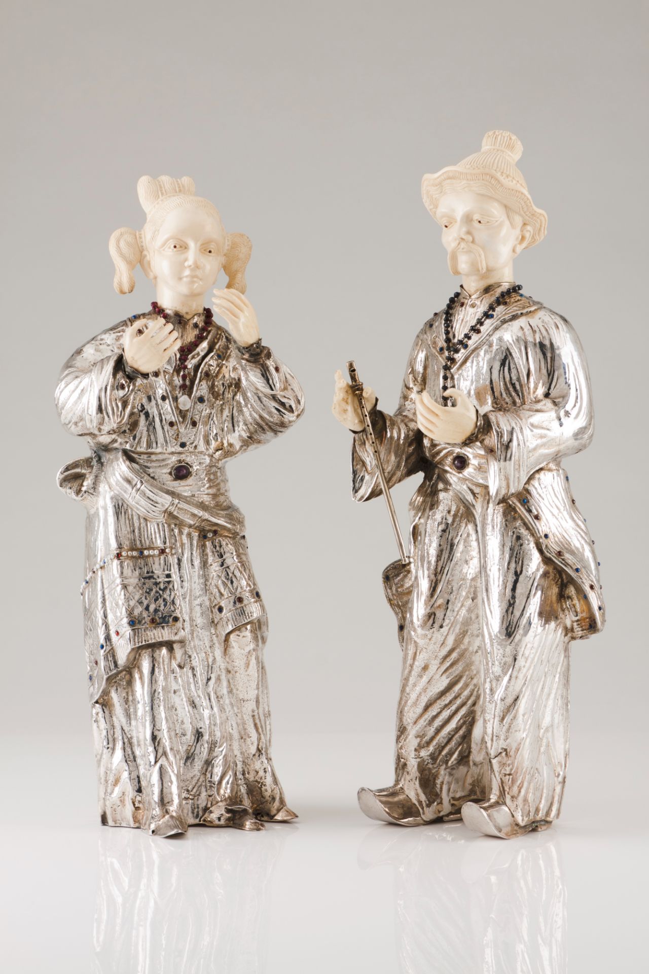 A pair of Luiz Ferreira dignitariesPortuguese silver Moulded, engraved and chiselled body Oriental