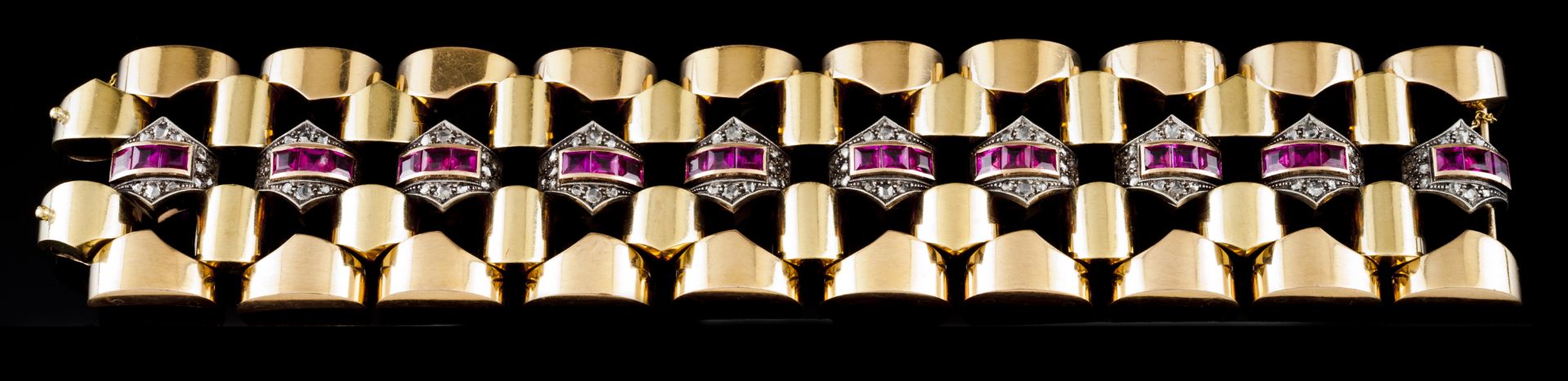 An Art Deco braceletGold and silver Set with synthetic rubies and rose cut diamonds Dog's head