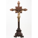 A Crucified ChristDarkened wood cross Carved and polychrome wooden Christ Portugal, 19th