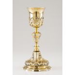 A chaliceGilt silver Shaft and foot of profuse foliage and shell raised decoration Raised decoration