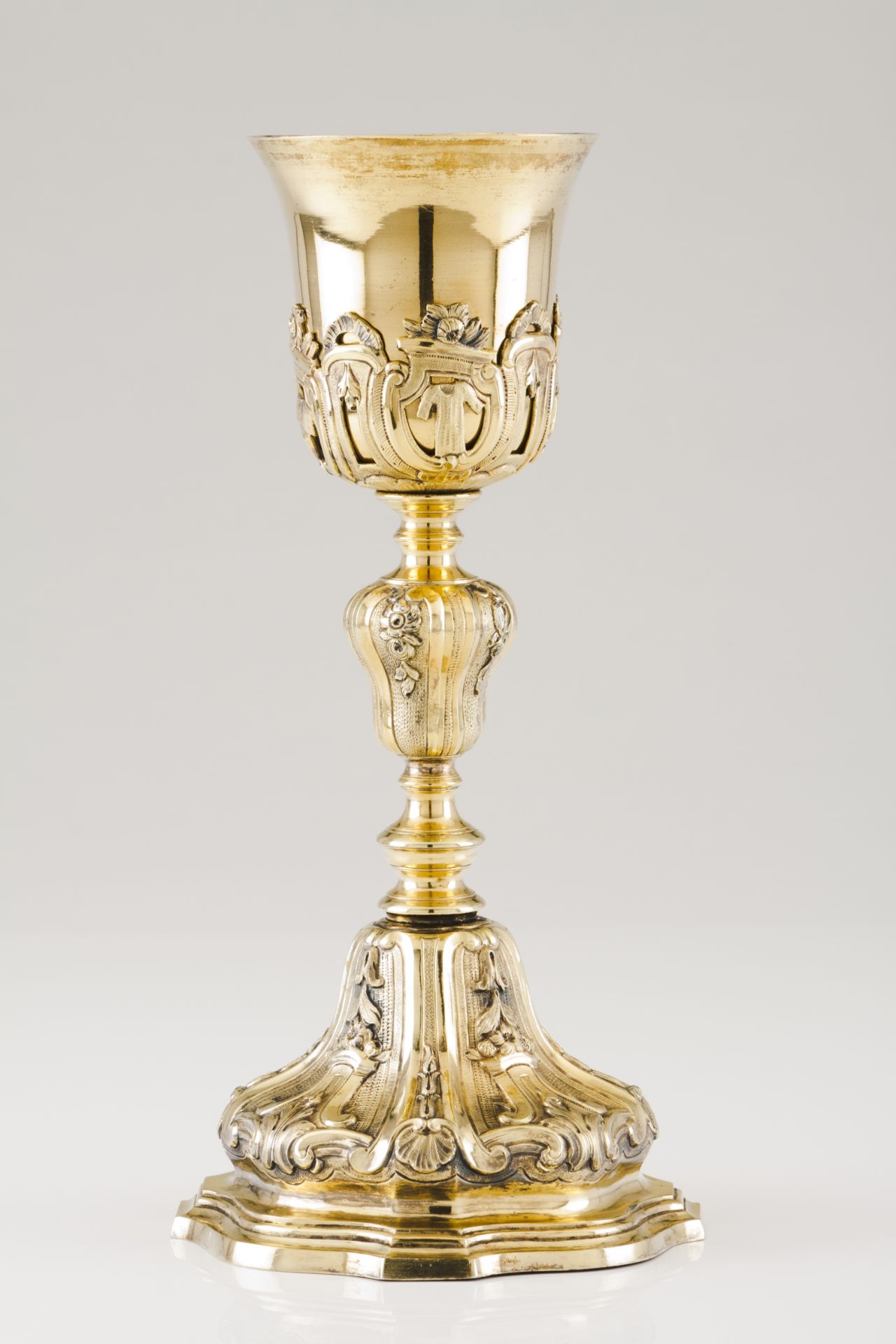 A chaliceGilt silver Shaft and foot of profuse foliage and shell raised decoration Raised decoration