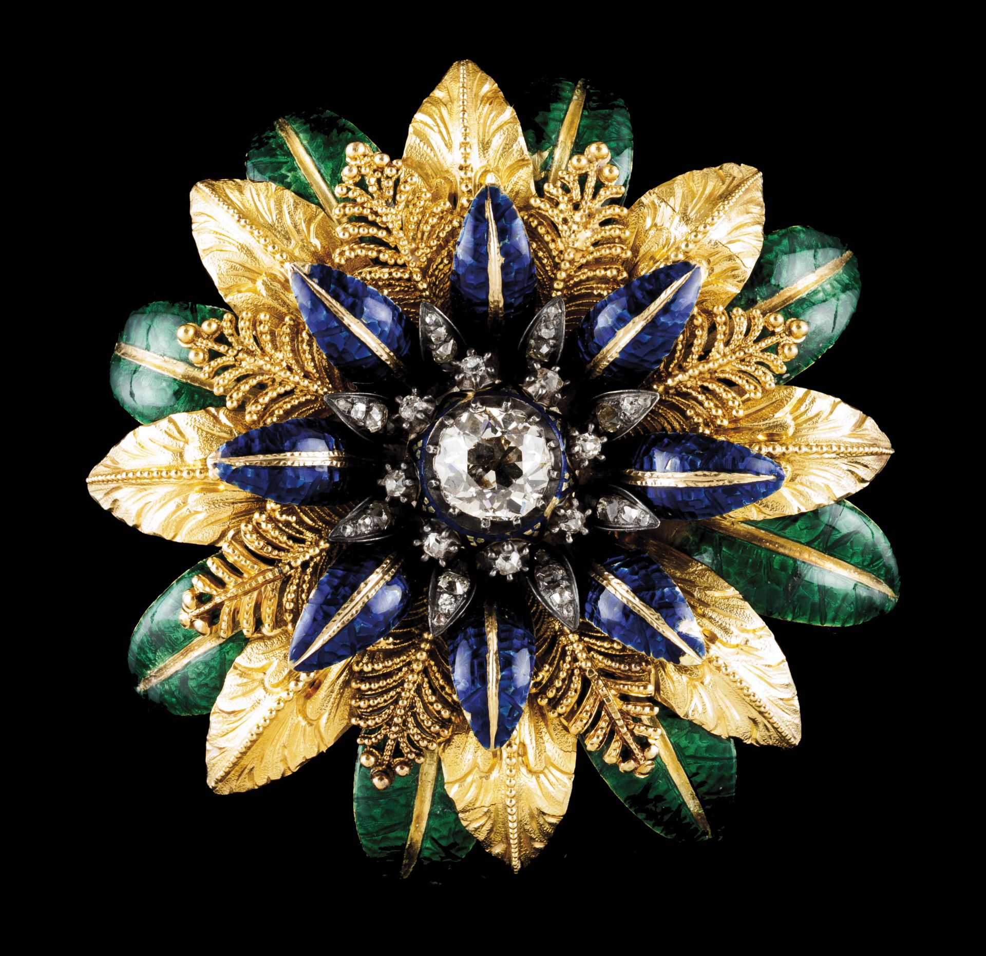 A large broochGold Flower made of 4 layers of blue and green enamelled leaves Central antique cut