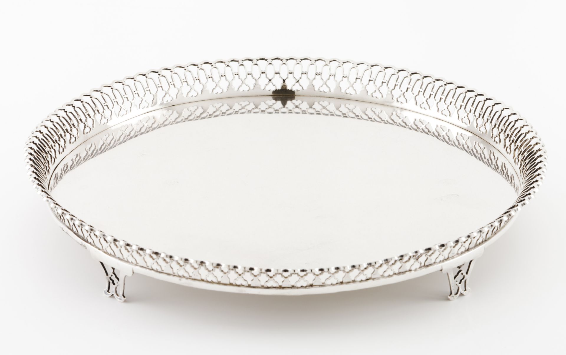A salverPortuguese silver, 19th century Plain centre of pierced geometric motifs gallery Unmarked in