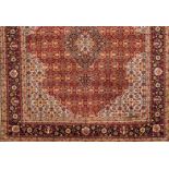 A Mud rug, IranWool and cotton Of floral pattern and central medallion in red, beige, blue and green