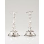 A pair of candlestandsPortuguese silver Romantic era decoration, of foliage engraved shaft and cup