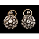 A pair of earringsSilver and Portuguese gold Pierced foliage inspired decoration set with small rose