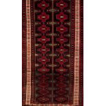 A Baluchi rug, IranWool and cotton Geometric pattern in bordeaux, blue, beige and green