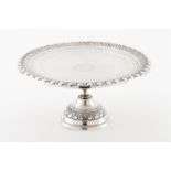 Unusual footed salverPortuguese silver, 18th / 19th century Plain centre with rosette and