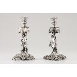 A pair of candlestandsFrench silver, 19th century Raised decoration with depiction of native in