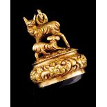 A wax stamp pendantPortuguese gold Goats on a raised foliage decoration base set with oval cut