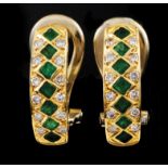 A pair of earringsPortuguese gold Set with one row of square cut emeralds framed by 2 friezes of