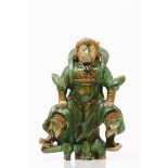 A warriorGreen and brown glazed ceramics depicting a warrior China, 19th century (losses and