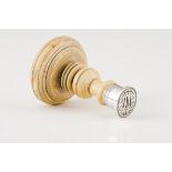 A wax sealSilver Turned ivory handle and seal with JAN monogram Unmarked in compliance with Decree-