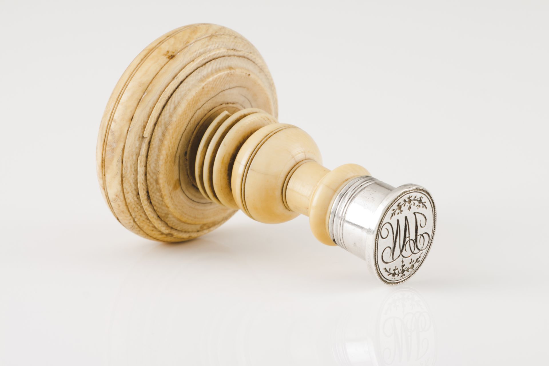 A wax sealSilver Turned ivory handle and seal with JAN monogram Unmarked in compliance with Decree-
