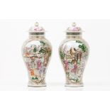 A pair of pots and coversEuropean porcelain in the Chinese manner Polychrome decoration of frames