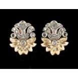 A pair of earringsSilver and gold Foliage inspired decoration set with small rose cut diamonds