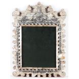 A votive print Carved and gilt wood frame Holy bishop by a salt paste made altar Textile