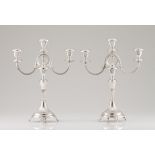A pair of three branch candelabraPortuguese silver Turned, fluted and chiselled shaft and base on