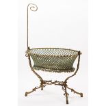 A Napoleon III cribGilt and chiselled bronze structure of naturalistic decoration Silk basket of