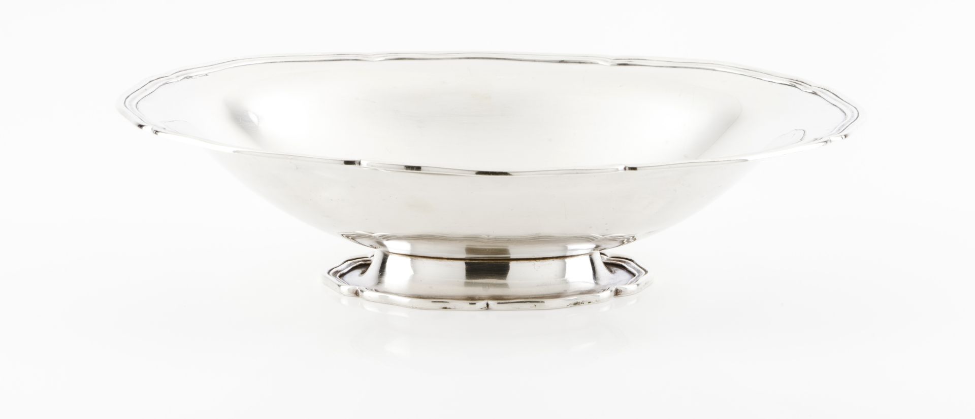 A fruit bowlPortuguese silver Oval shaped of plain body and grooved rim on an oval foot Eagle