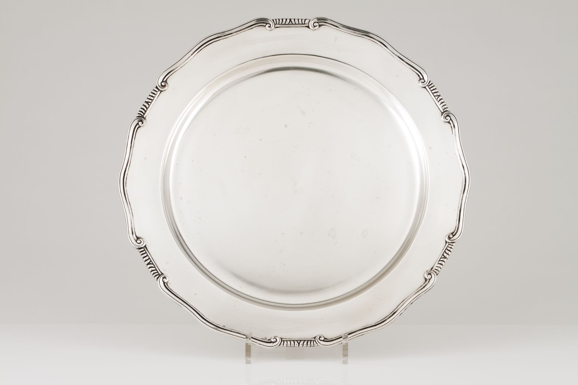 A large serving platterPortuguese silver Plain centre of scalloped rim and volutes and gadrooned