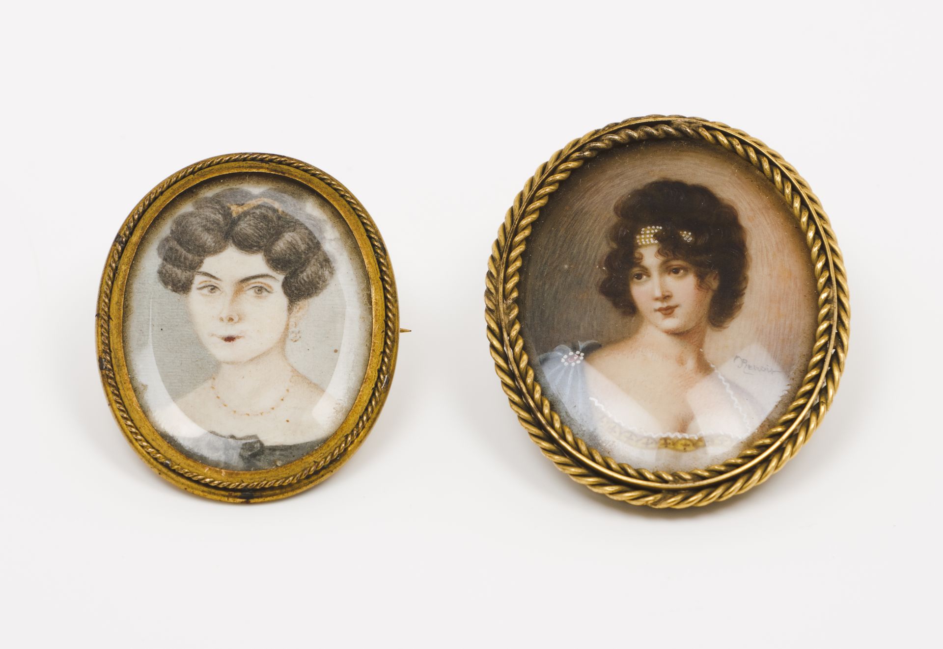 European school, 19th/20th centuryPortraits of ladies Two gilt metal brooches with miniatures on